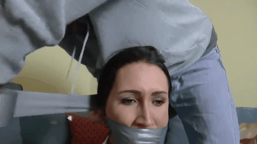Helpless girl duct tape wrap gagged tight by intruder