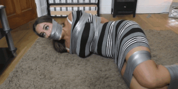 Tied brunette duct tape wrap gagged and helpless in tape bondage
