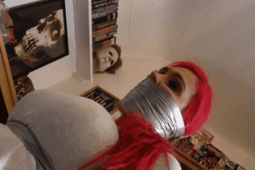 Squirming Redhead Tied Up In Horror House