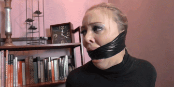 Blonde Girl With Fake Lips Tries To Talk Through Heavy Black Duct Tape Cleave Gag