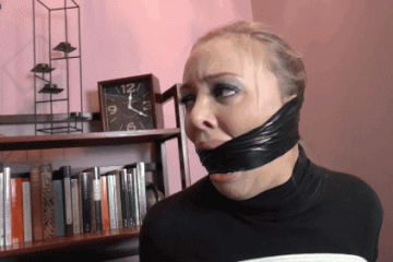 Blonde Girl With Fake Lips Tries To Talk Through Heavy Black Duct Tape Cleave Gag