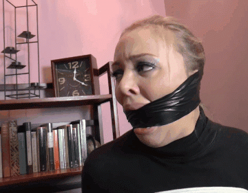 Blonde Girl With Fake Lips Tries To Talk Through Heavy Black Duct Tape Cleave Gag