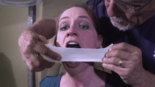 Taping Black Panties In Her Mouth With White Medical Tape