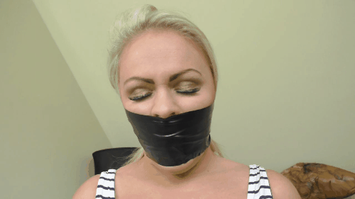 Gorgeous Blonde With A Tight Black Tape Gag