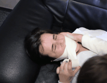 Woman gets medical microfoam tape gagged on the sofa
