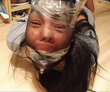 Pantyhose encased girl gagged extremely tight