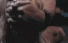 This gif shows a blonde girl fucked with the guy's hand over her mouth