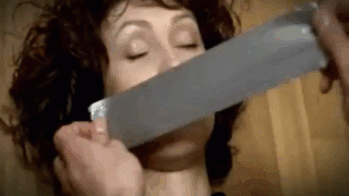 A gif showing the hands of a man duct tape gagging a sleeping woman. She wakes up gagged
